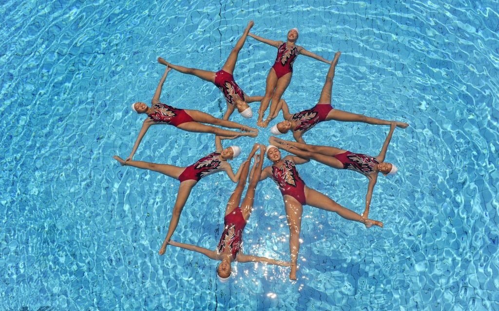 Synced Laughter: Exploring the Hilarious Side of Synchronized Swimming